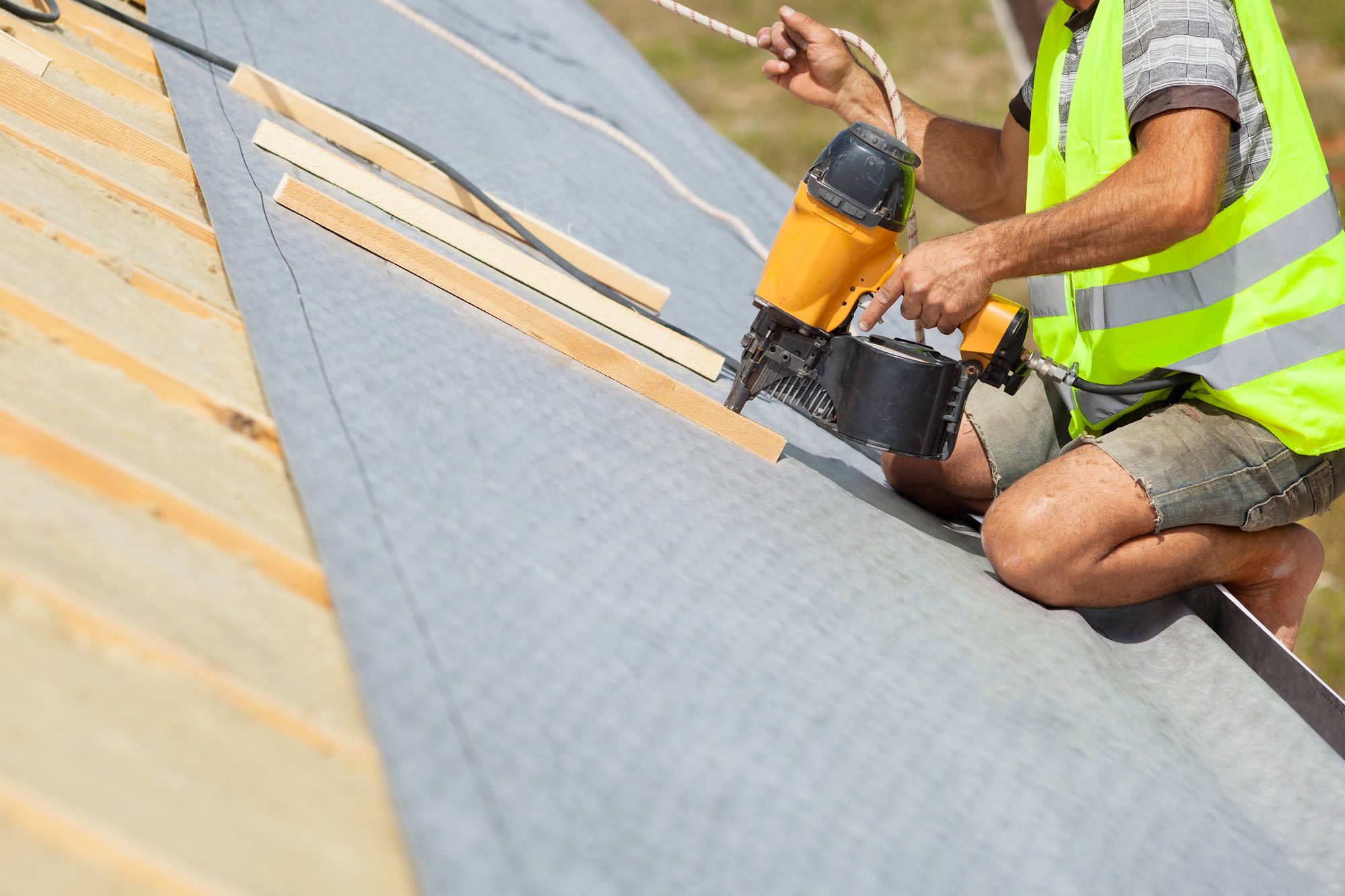 roofing membrane being installed